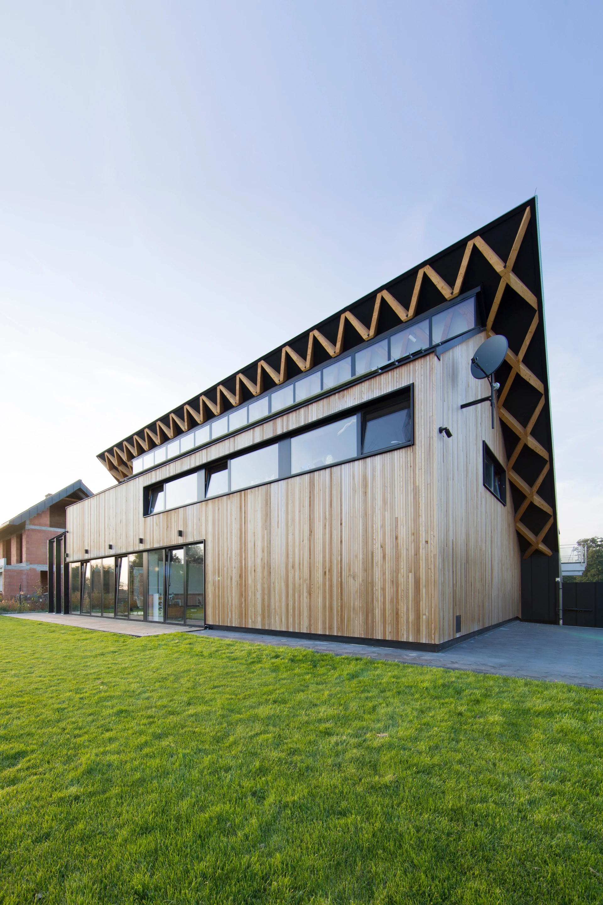 House behind the Roof's south-facing windows are carefully placed to maximize natural ventilation and light