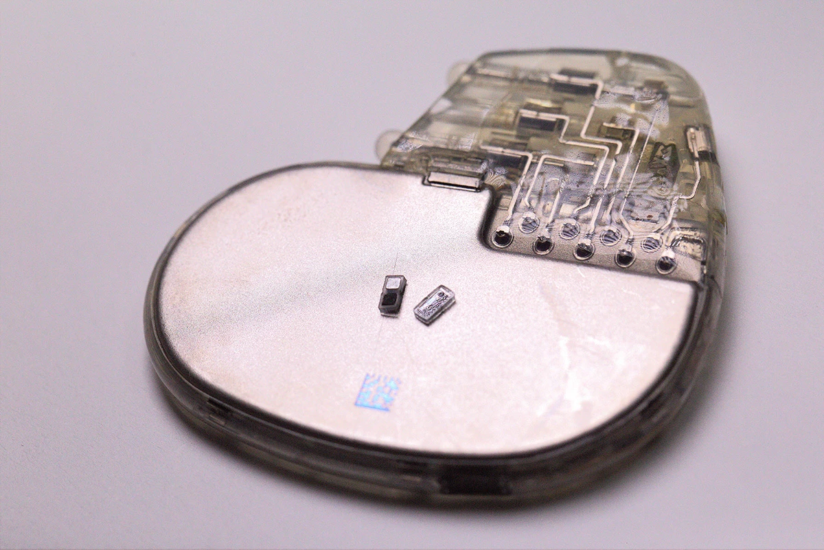 You're looking at two tiny pacemakers sitting atop a traditional pacemaker for scale