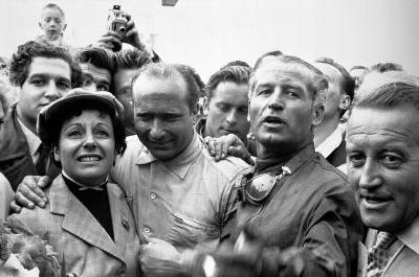 Juan Manuel Fangio, longtime companion Andrea Buerret and Karl Kling