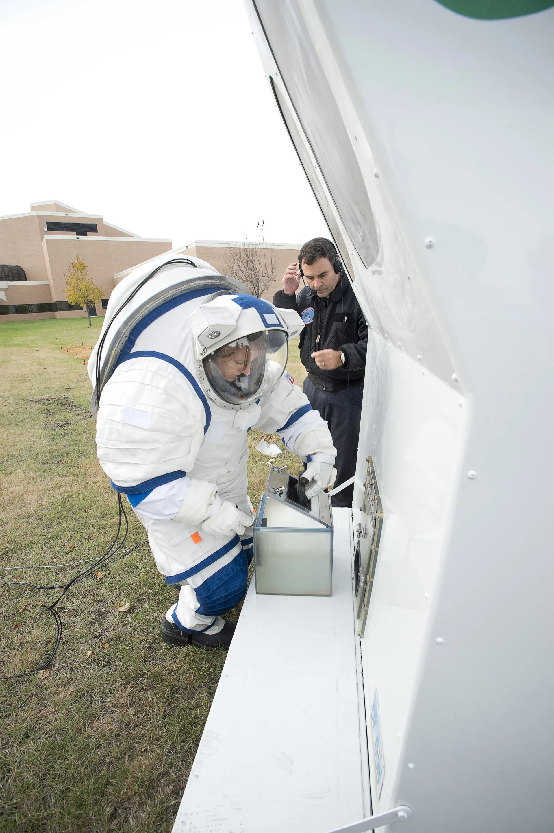 University of North Dakota's NDX-2 suit tester, Tiffany Swarmer, stowing a sample (Photo: Pablo de León/Tiffany Swarmer/UND Aerospace Network)