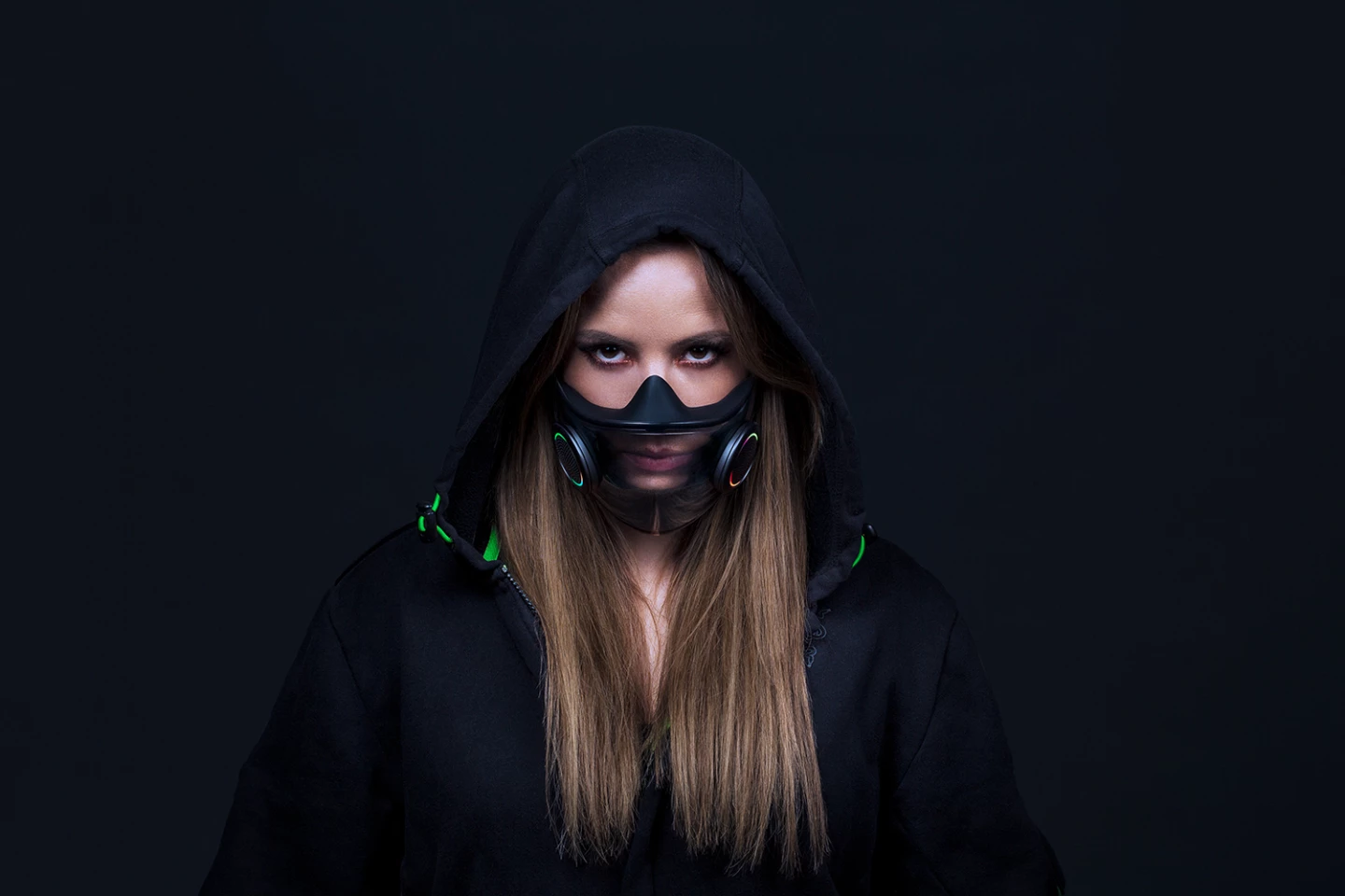The mask is transparent, allowing the wearer's mouth movements to be visible