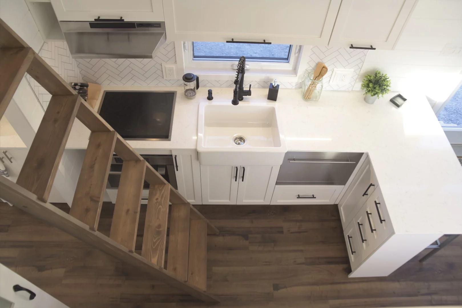 The Magnolia's secondary bedroom is accessed by removable ladder