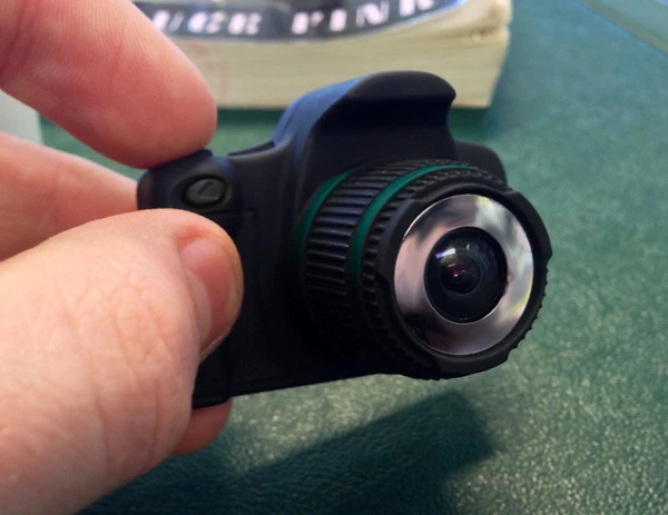 Pressing and holding the power button on the top brings the camera to life and it goes straight into HD video mode