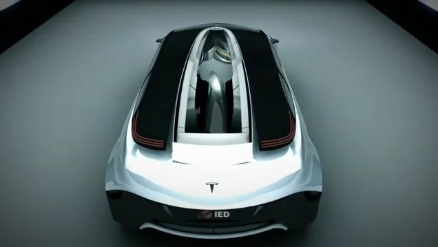A 3D rendering of the top rear view of the Tesla IED Eye concept car, showing its opening top