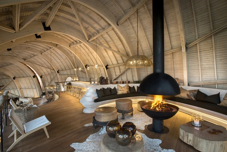 The skin of the Sandibe Okavango lodge is formed of layers of pine scale planks, which are waterproofed with an acrylic membrane and covered in Canadian cedar shingles