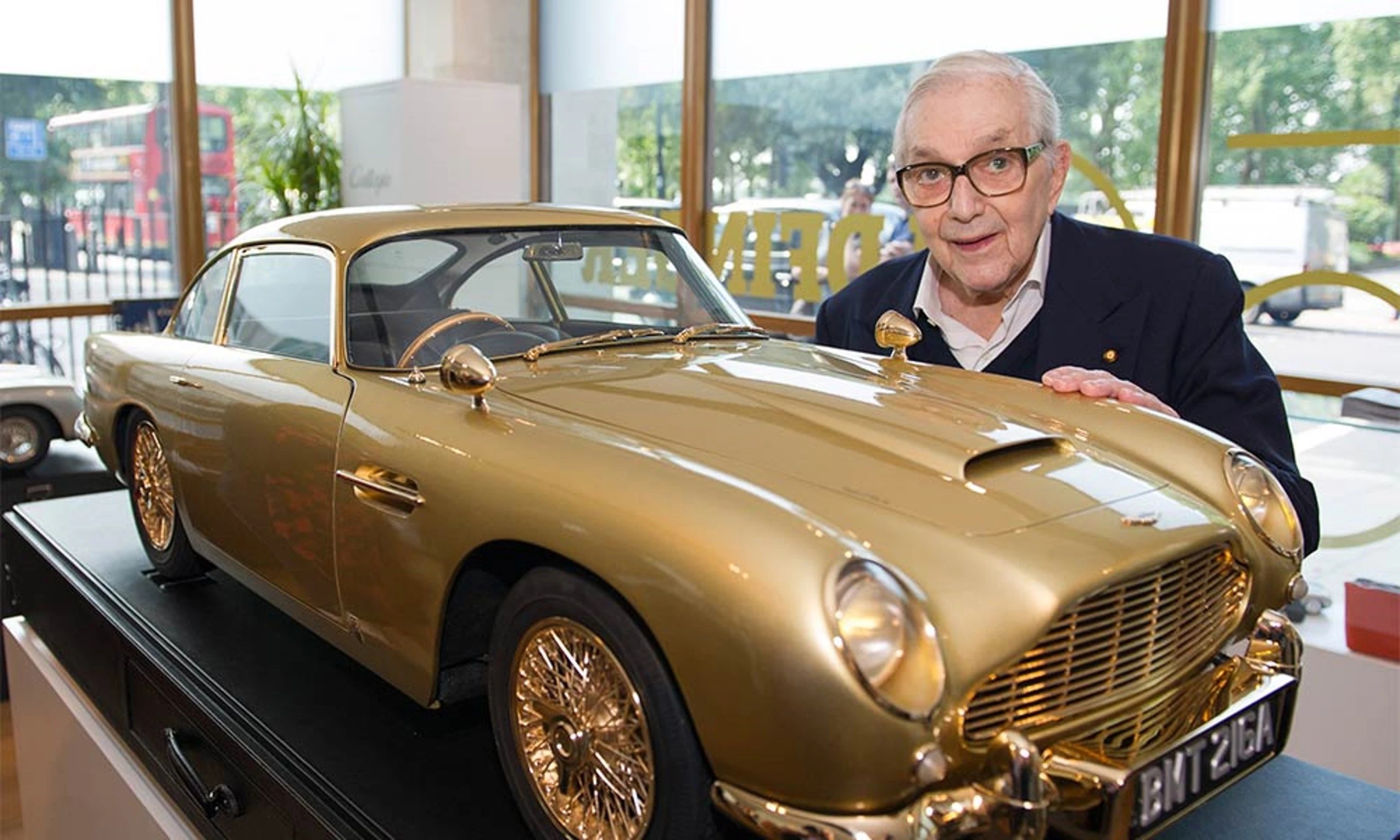 Sir Ken Adam, designer of the "Q Branch" DB5, and the scale replica (Image: Aston Martin)