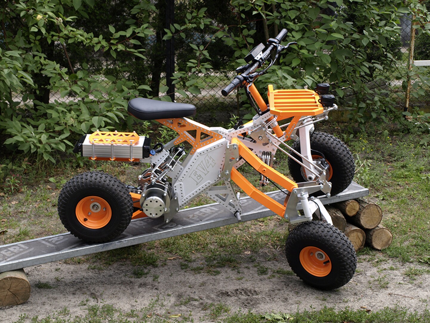 Tilting electric quad gets menacing offroad big brother
