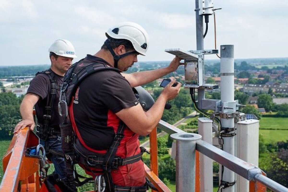 KPN technicians install a LoRa gateway onto a mobile transmission tower in the Netherlands, as part of the rollout of a new IoT-dedicated network