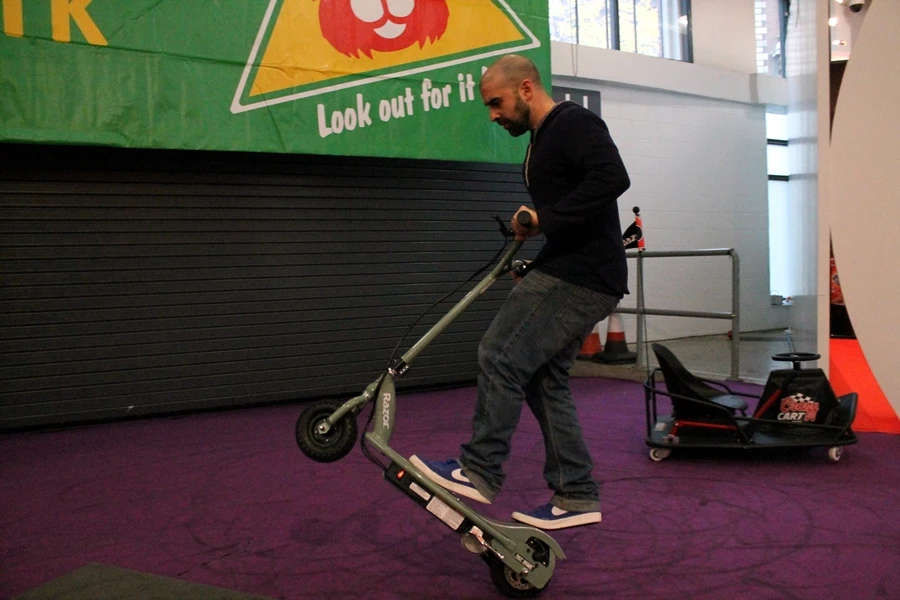 Ali Kermani pulls a wheelie on the RX200 Electric Scooter (Photo: Gizmag/Stu Robarts)