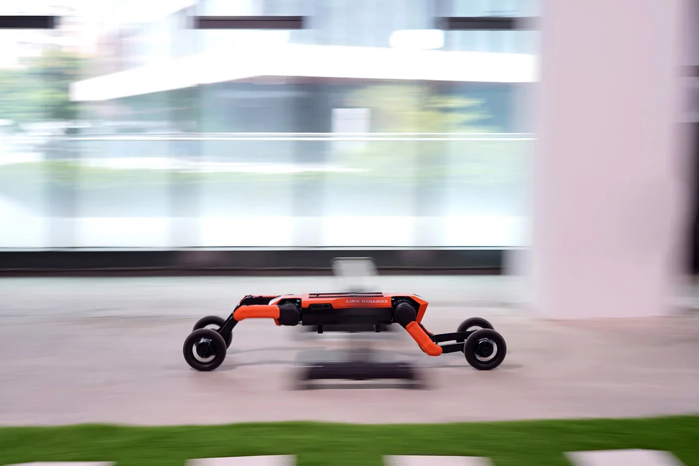The W1 limbos its way under a hurdle as it rolls in wheel mode