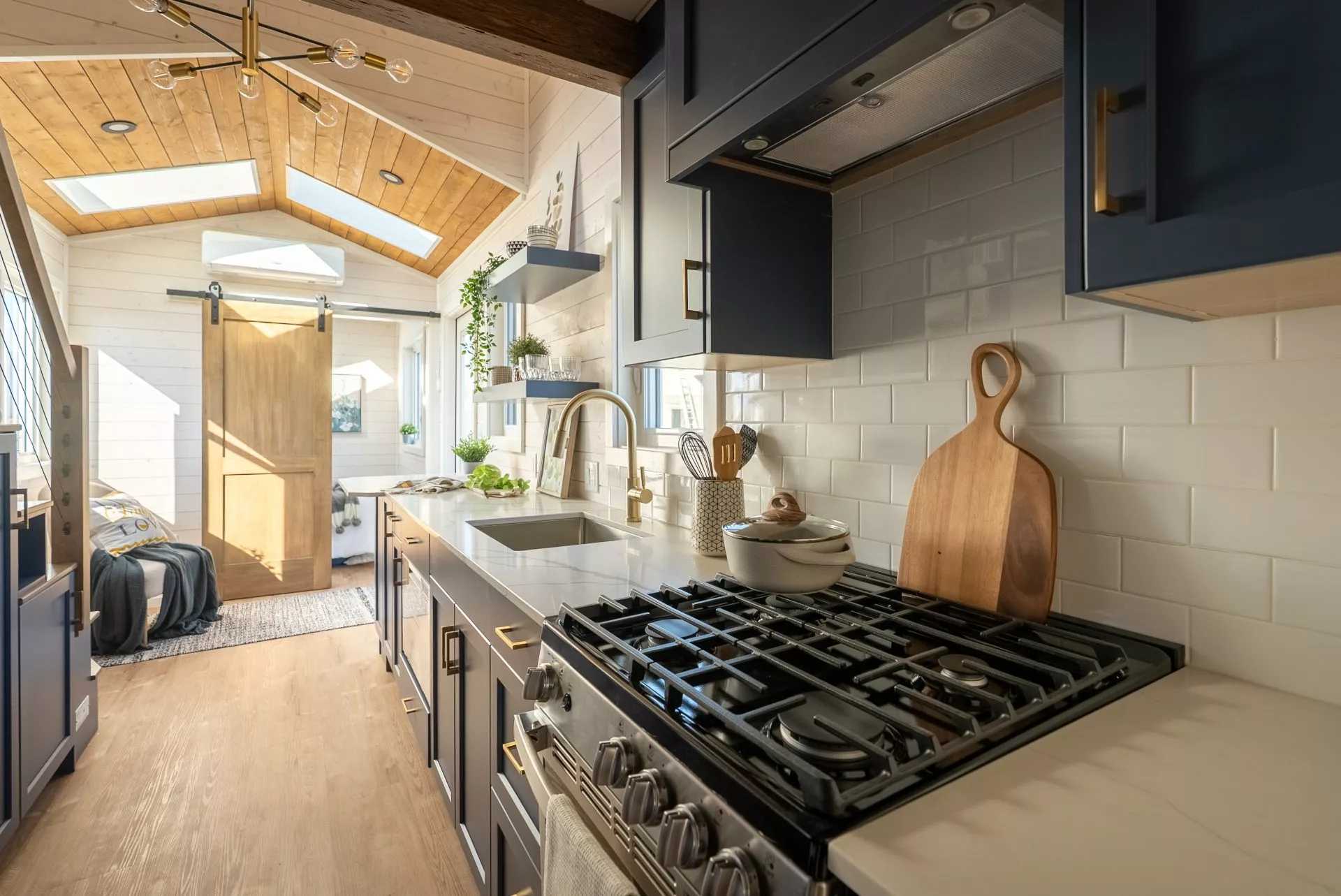 The Gambier's kitchen includes an oven and a propane-powered four-burner stove