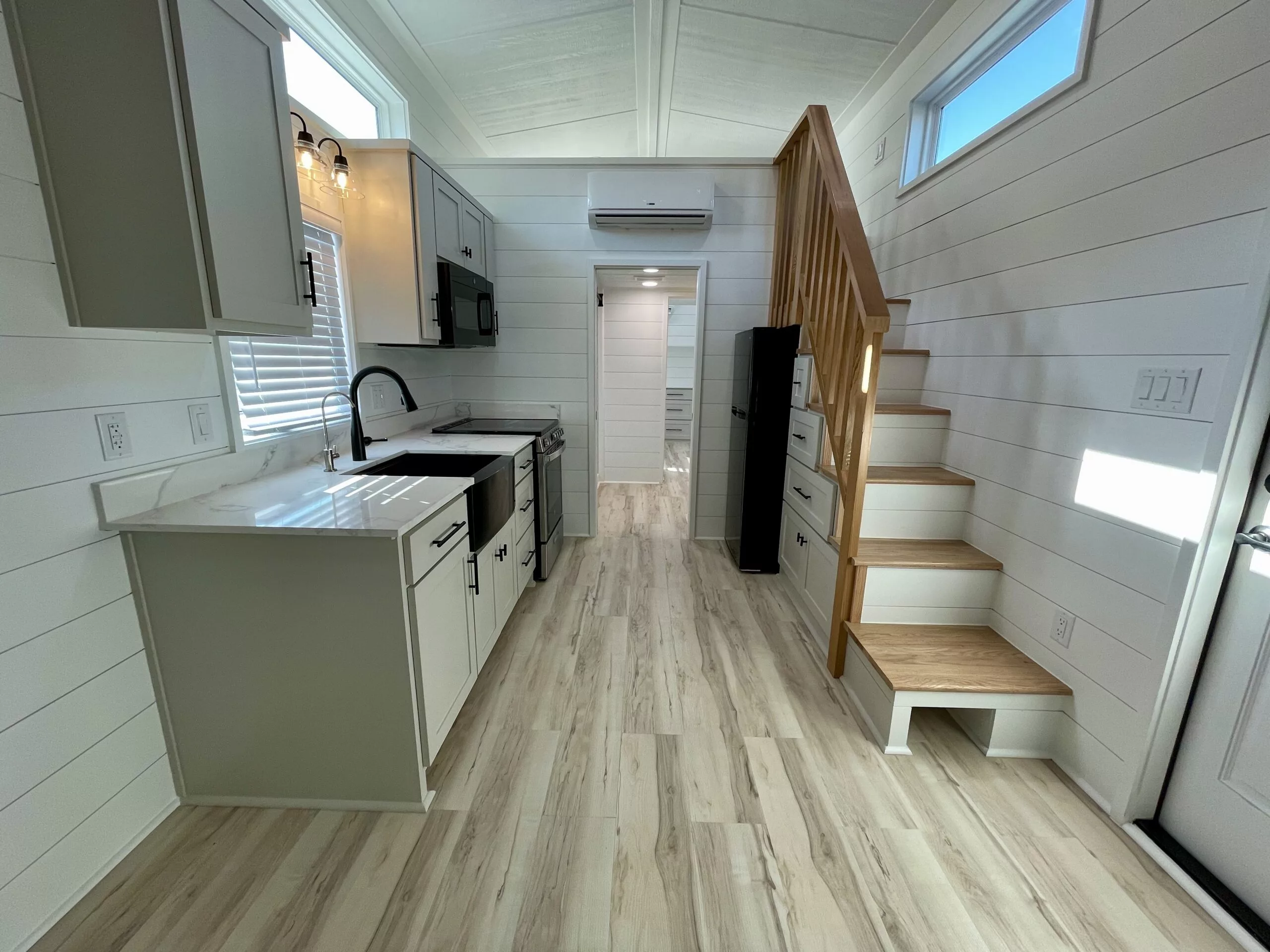 The New Chapter's loft-based storage/hobby room is reached by a storage-integrated staircase