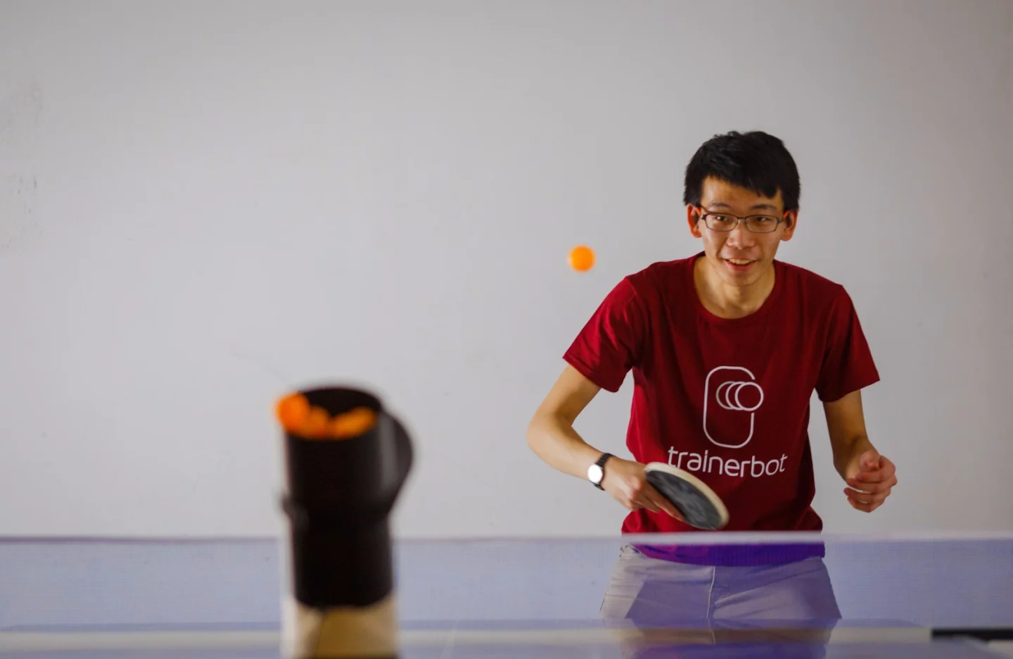 Trainerbot features a top-loading hopper that can hold up to 30 ping-pong balls at one time