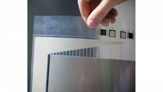 A sheet of plastic that has been imprinted with thin lines of conductive metal (Images: Porter Gifford)