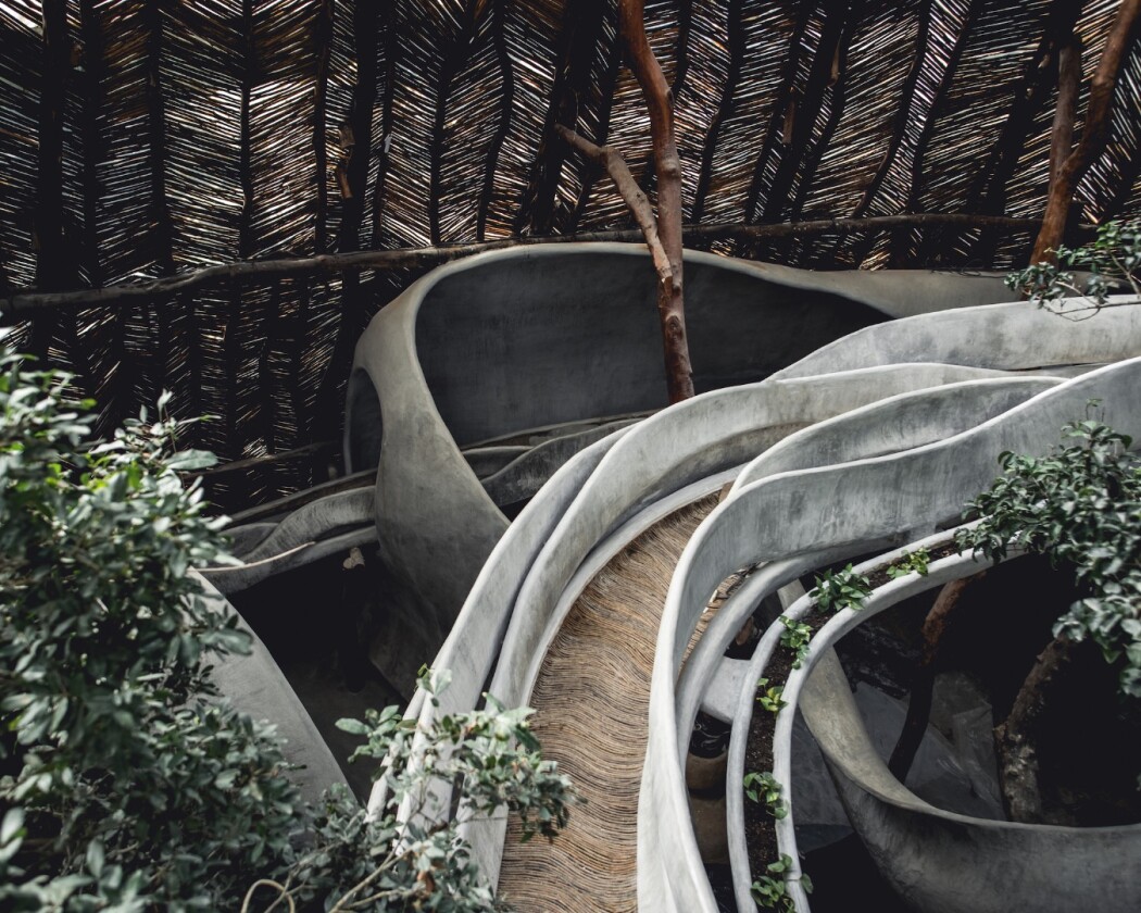 Azulik Uh May's visitors will pass through meandering paths and bridges between the trees