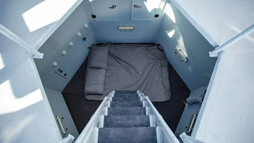 Stairs lead down to the Lunar Lander's bedroom
