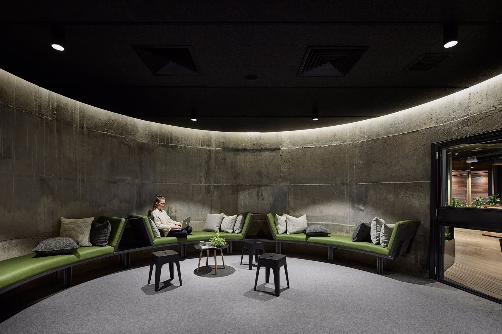 Leftover from the building's brewing days are storage silos that have been repurposed as meeting rooms and a lounge