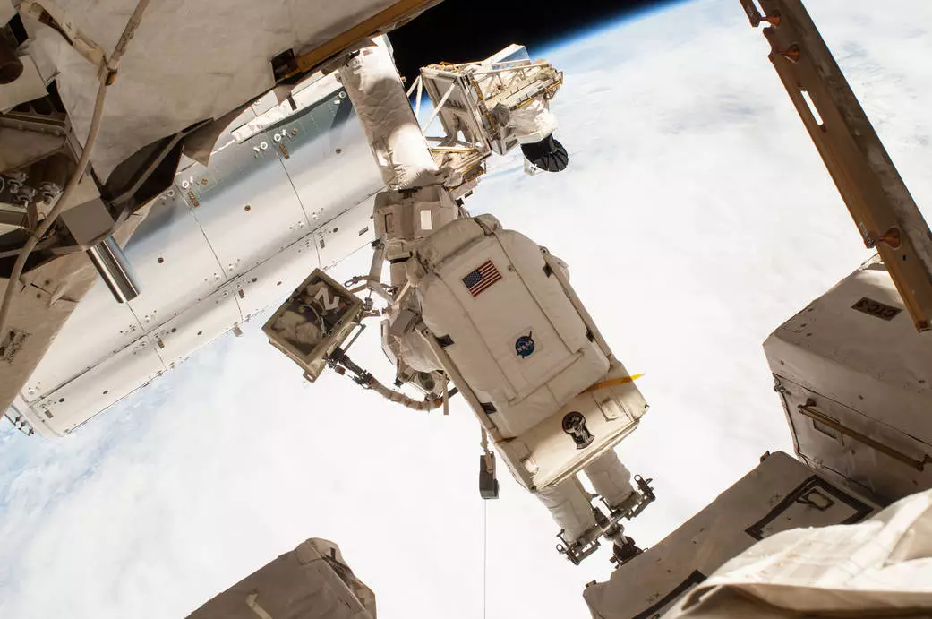 NASA astronaut Terry Virts outside the International Space Station as part of a mission to reconfigure it for docking by US commercial crew vehicles