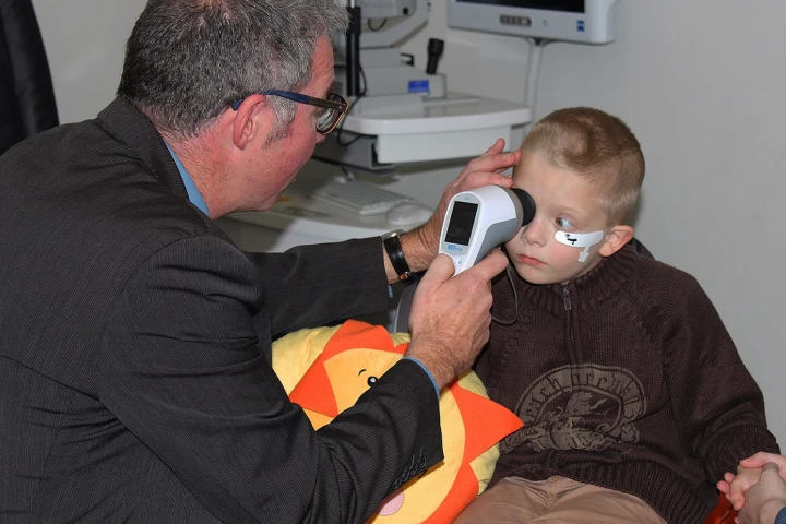 Australian researcher Paul Constable demonstrating his novel eye-scanning device that can reportedly diagnose autism in children