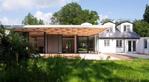 House for Theo and Oskar was designed by Tigg + Coll Architects and is located in Surrey. It involved the careful renovation of a small family cottage into a house suitable for two young boys with Duchenne Muscular Dystrophy