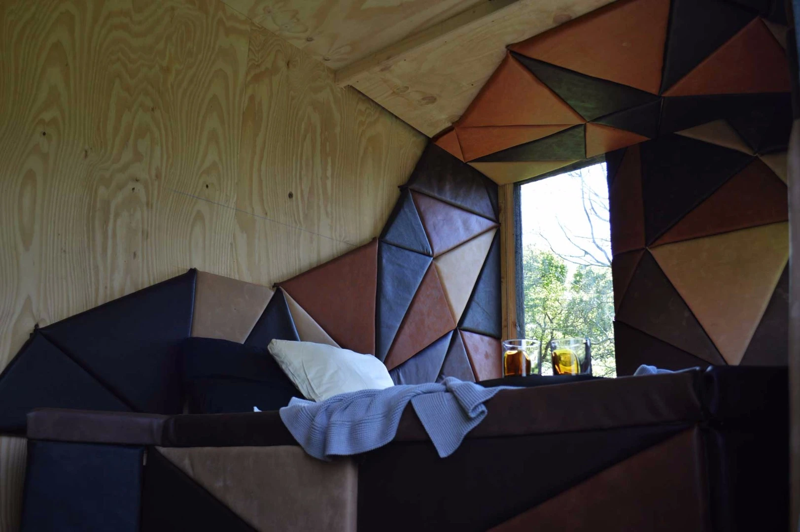 The sleeping zone doubles as a comfy spot to lounge, relax and read a book during the day