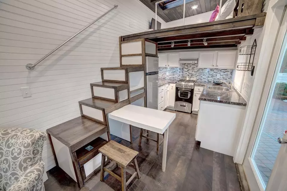 A pop-up table serves as a kitchen and dining table