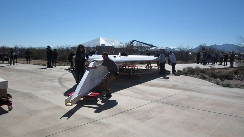The ground crew, readying Arturo’s Desert Eagle for its flight