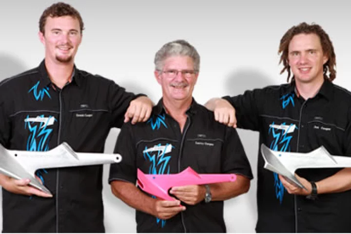 The Cooper Plastic Anchor for small watercraft being held by inventor Larry Cooper in between sons Jon and Grant