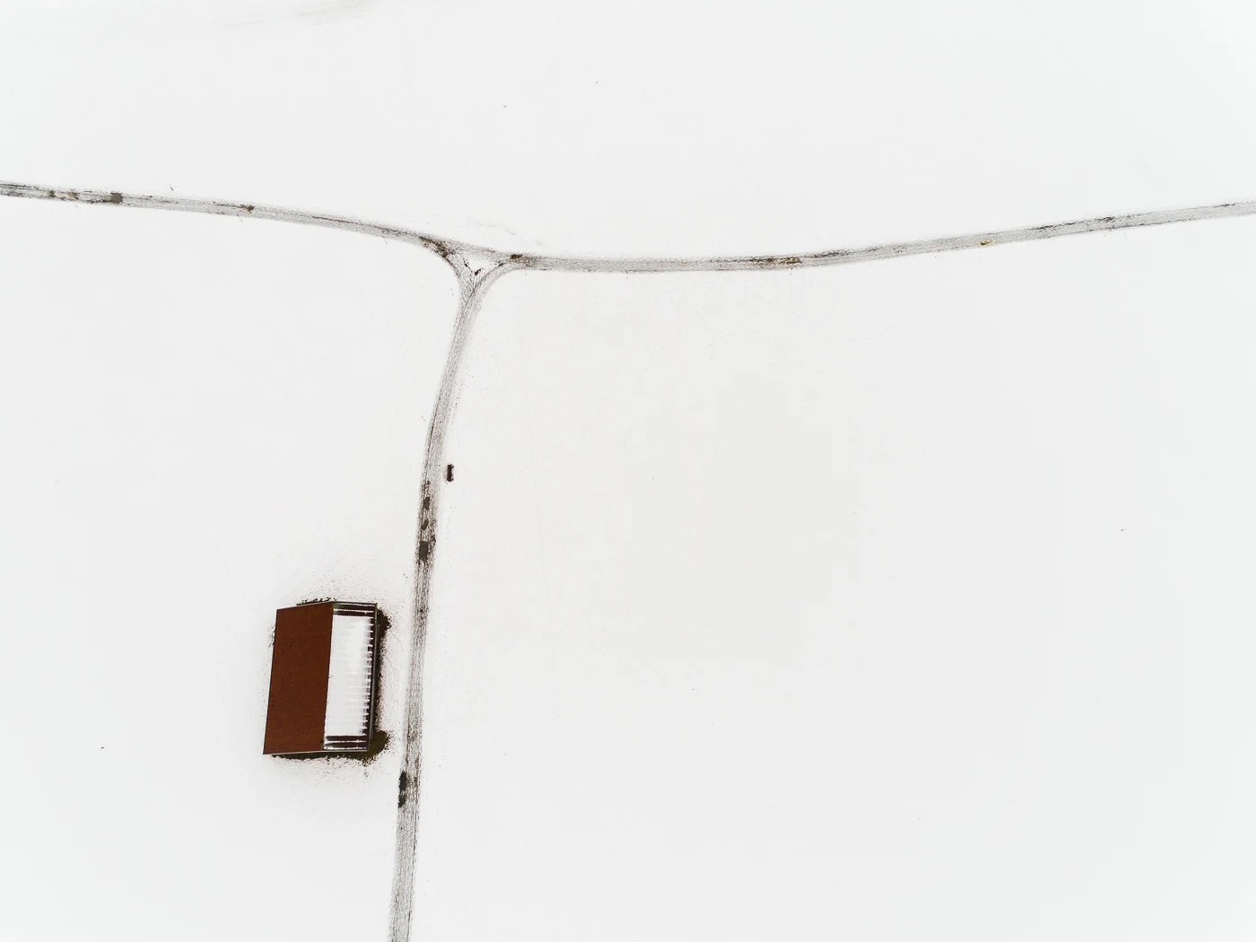 The Farmland Series: A look at farmland during winter in the Allgaeu Alps, a pre-alpine region in Germany. These open landscapes become dusted with white snow leaving only the human farming traces to stand out