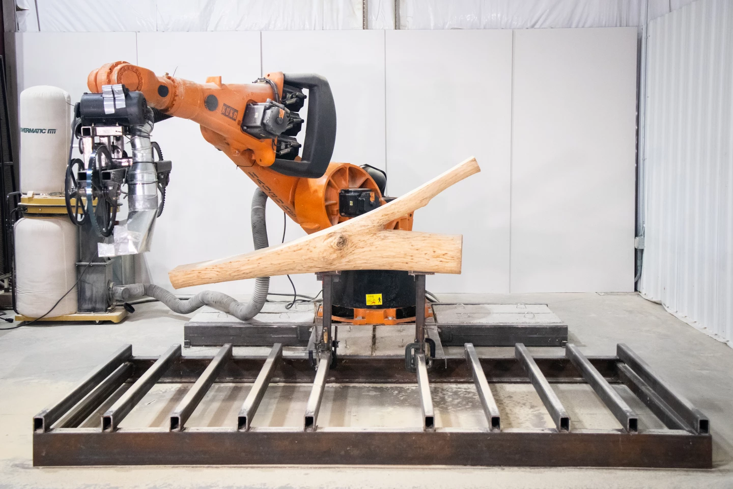 Ashen Cabin's wood sections were created using a robotic arm purchased on eBay that was previously used to build cars for General Motors