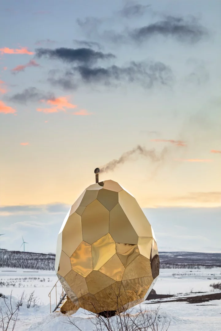 The Solar Egg is constructed from wood and clad in 69 pieces of stainless steel sheeting with gold coating