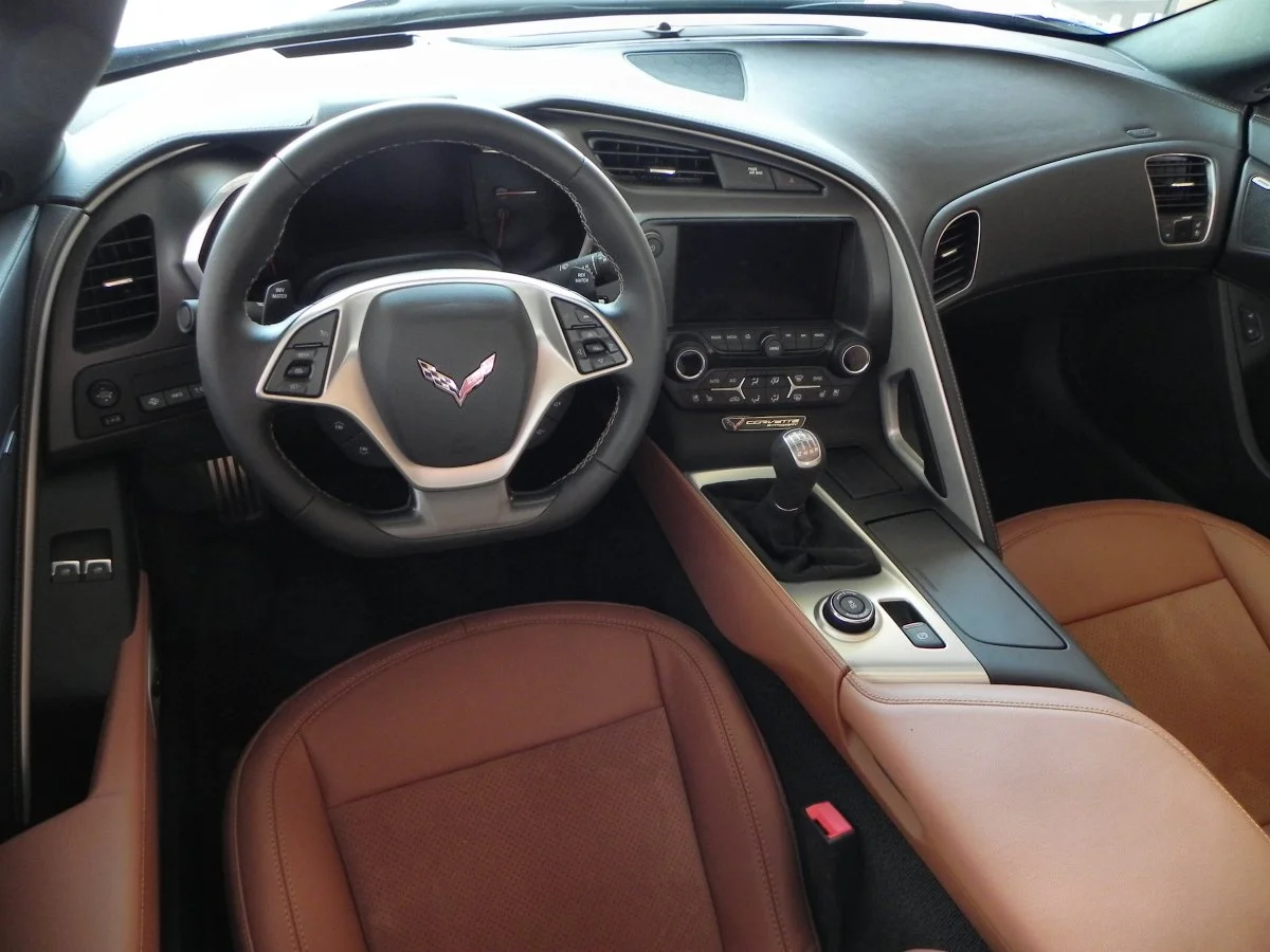 Note that the infotainment screen slides down out of view to reveal a felt-lined box behind with an integrated USB port