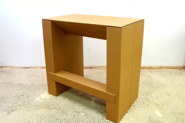 The Cardboard Standing Desk offers an affordable way of sitting less while working