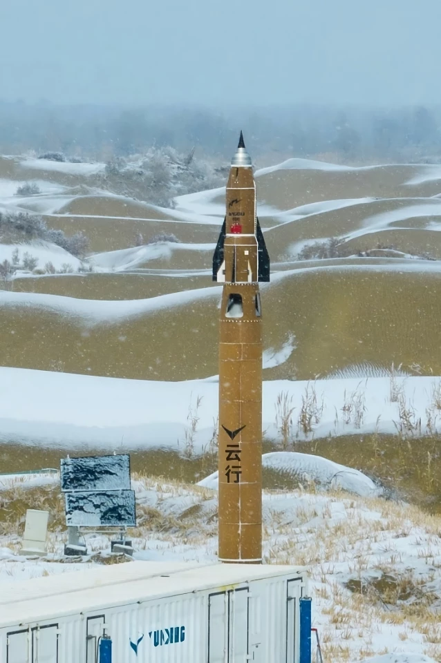 The JinDou400 test craft mounted on top of a rocket before being released at 20,000 ft (6,100 m) for flight test