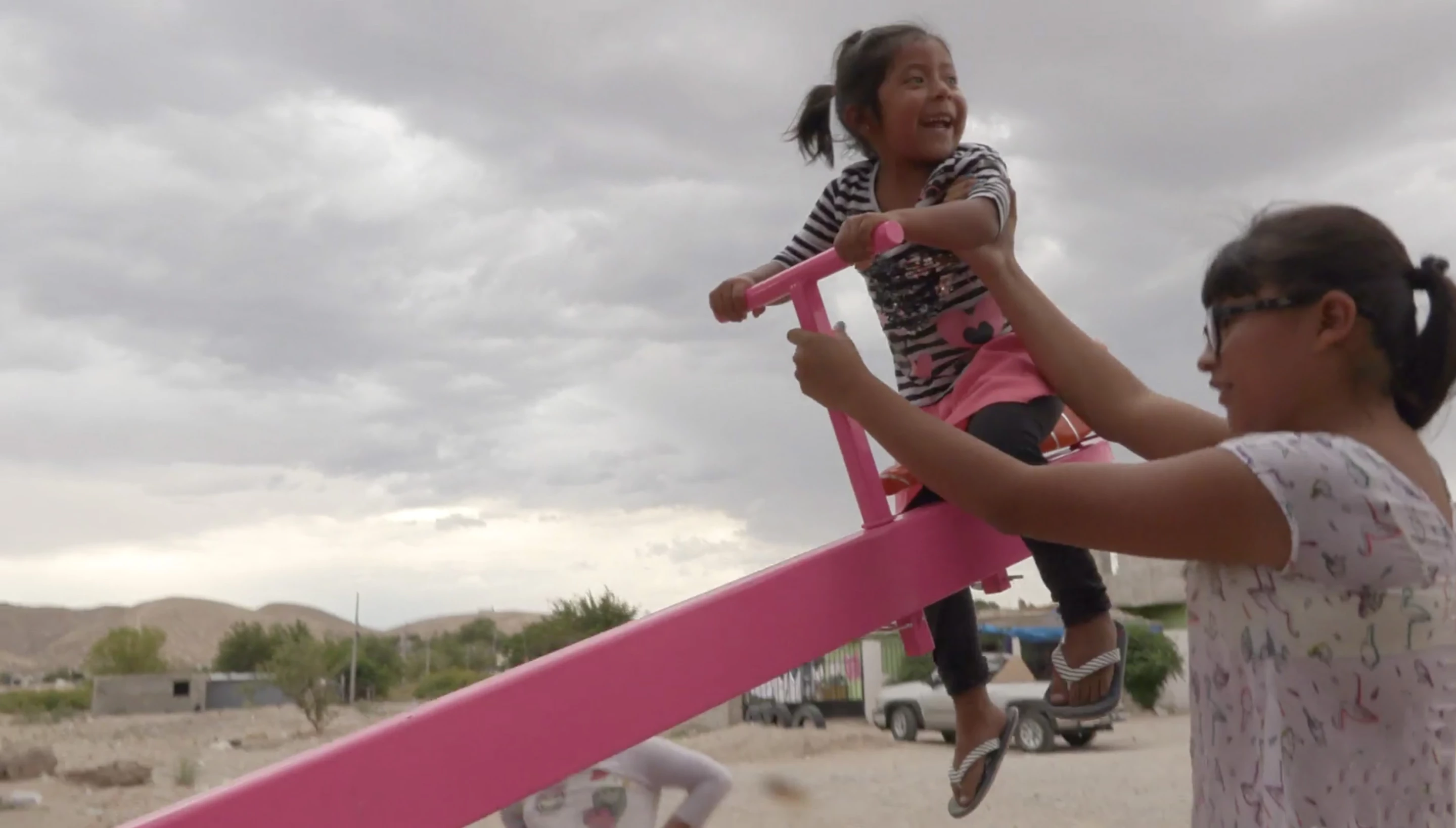 Teeter-Totter Wall was only installed for 20 minutes, which was just enough time for some Mexican and American kids to play together