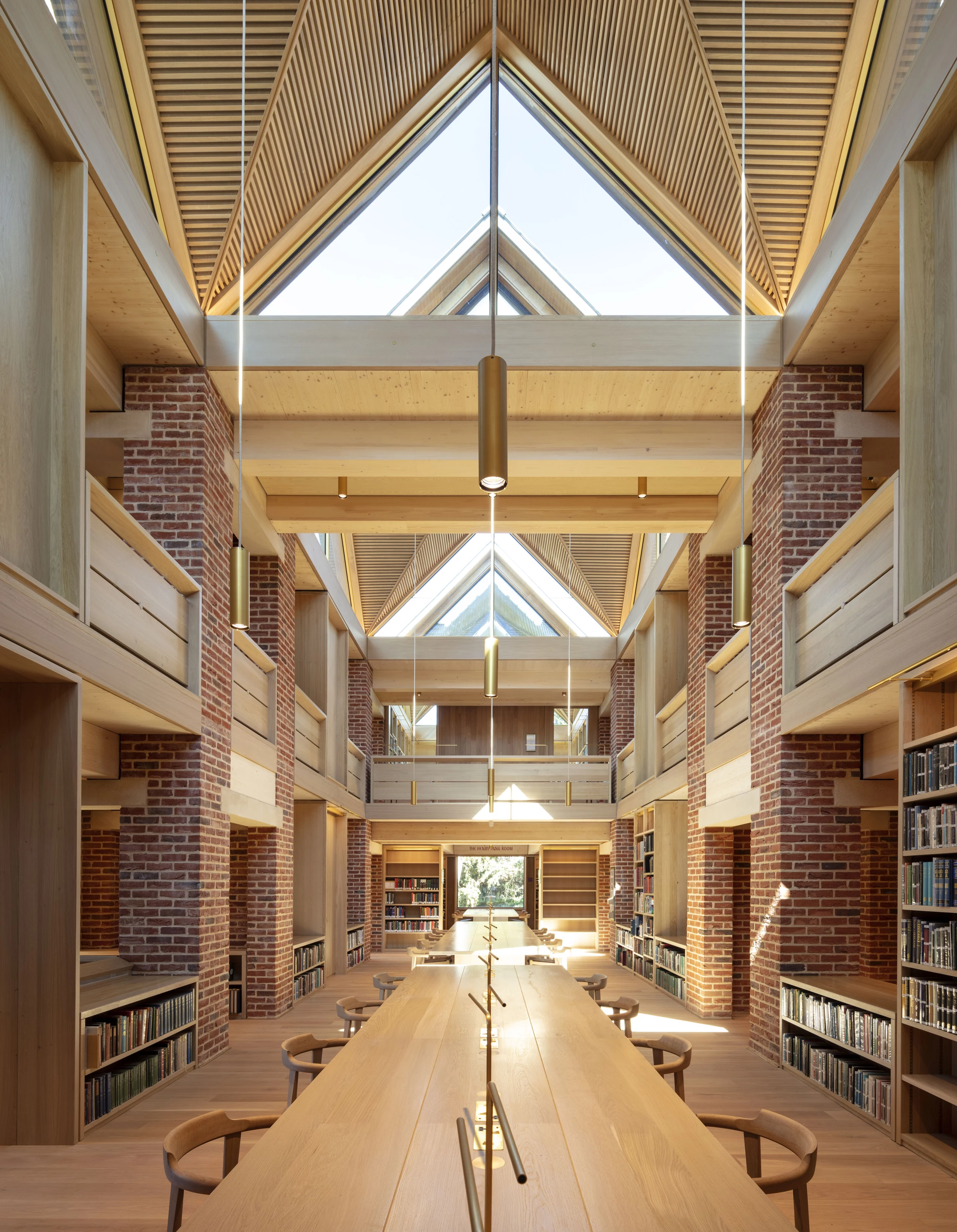 The New Library, Magdalene College was designed by Niall McLaughlin Architects and is located in Cambridge. The project serves as a college library that's built to last an impressive 400 years