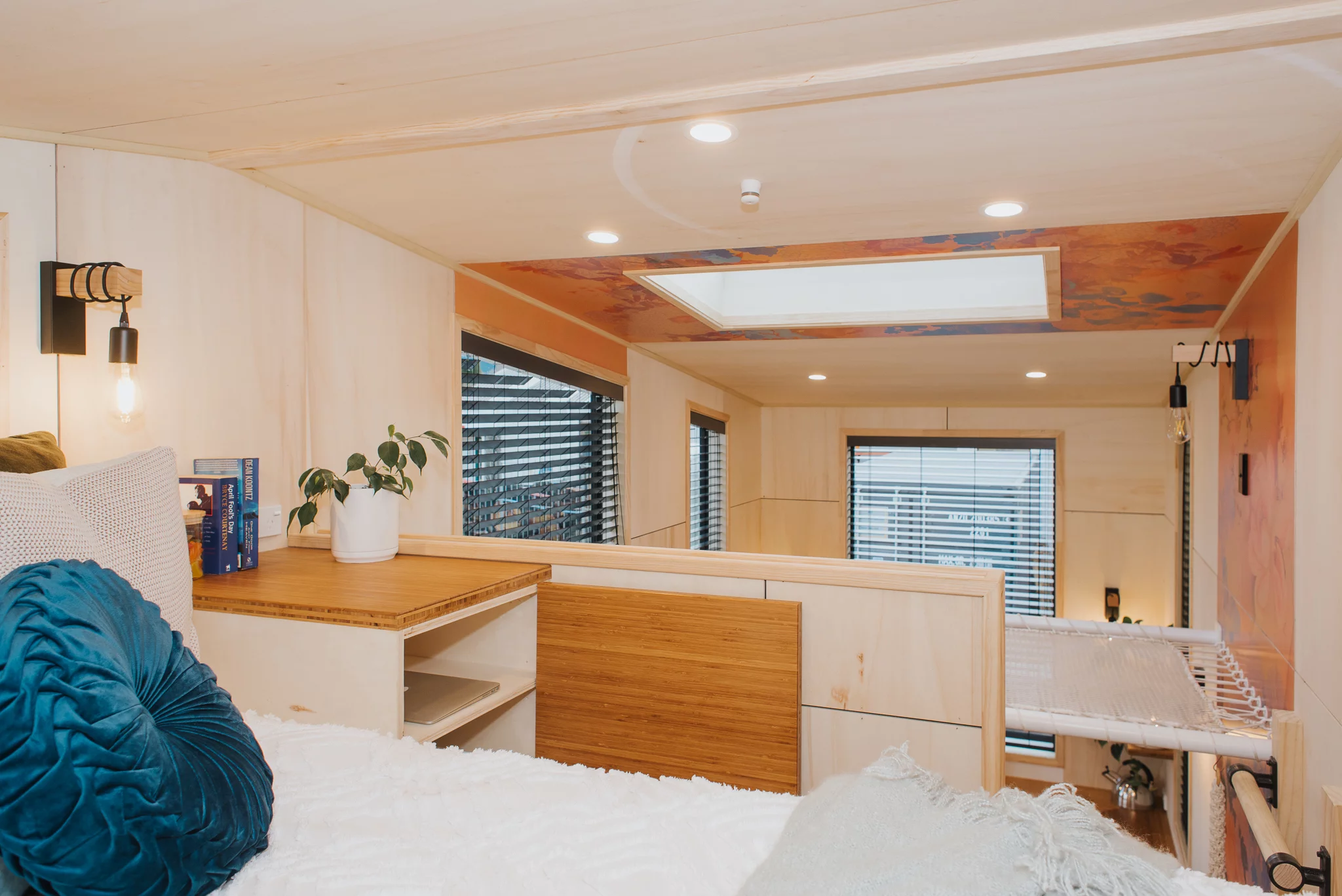 The Autumn has just one bedroom, which is a typical tiny house-style loft bedroom with a low ceiling