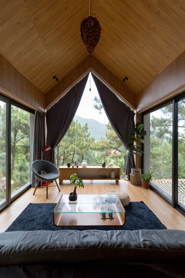 Inspired by treehouses, the home has a stunning living room that sits high in the tree tops