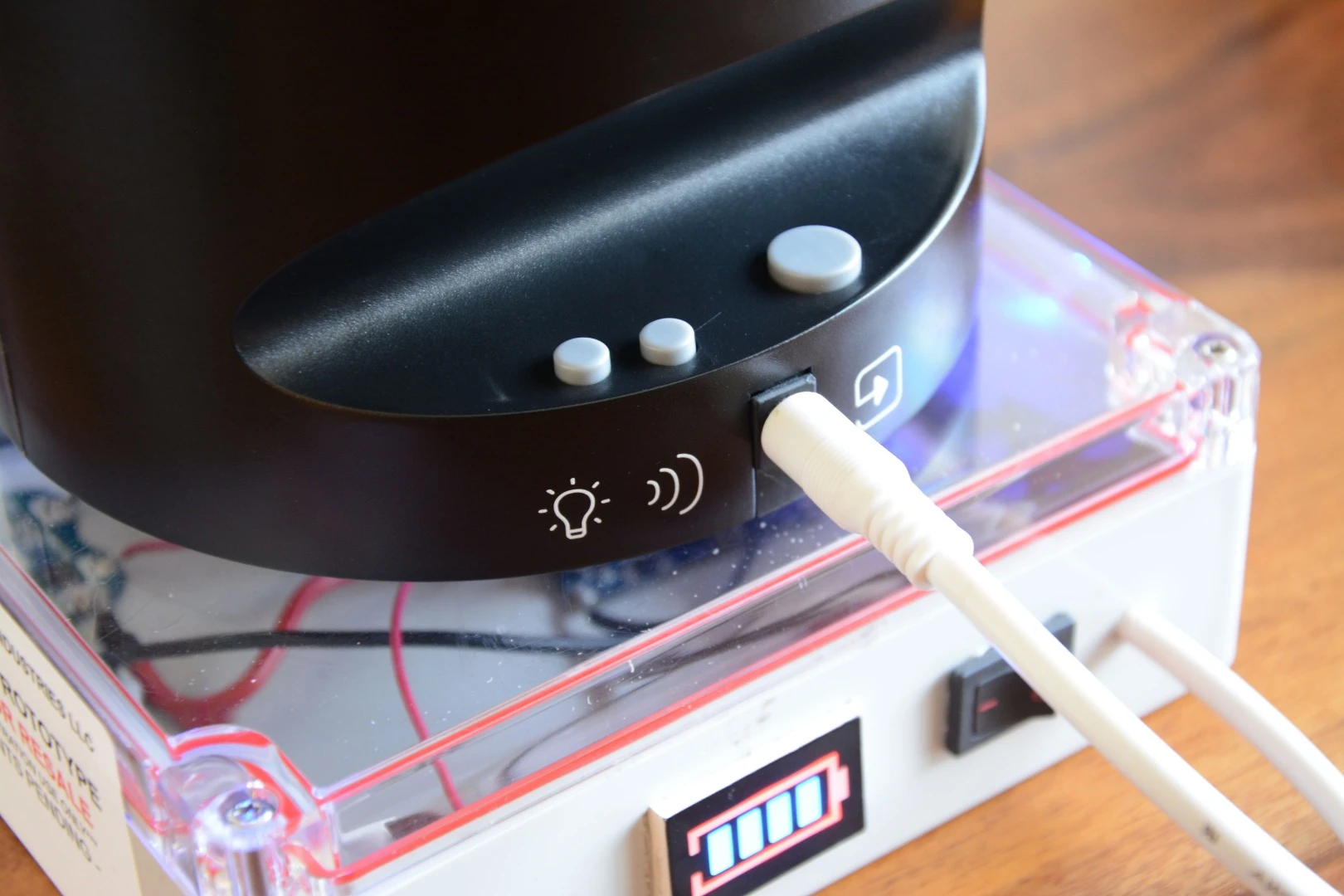Buttons on the back enable or disable the LED lights and ker-ching sound, and also manually feed a card out the front slot
