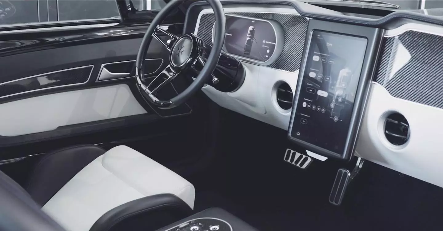 A large tablet-like infotainment screen and rounded digital instrument display provide a modern driver interface