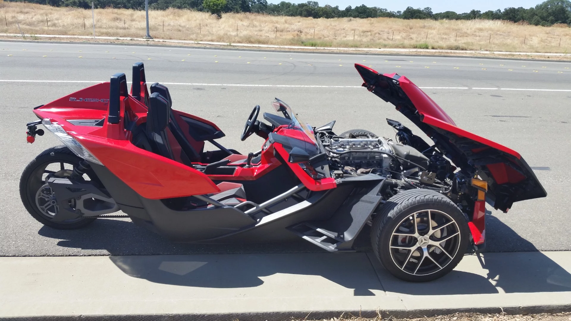 The hood is easy to raise and provides good access to the engine bay