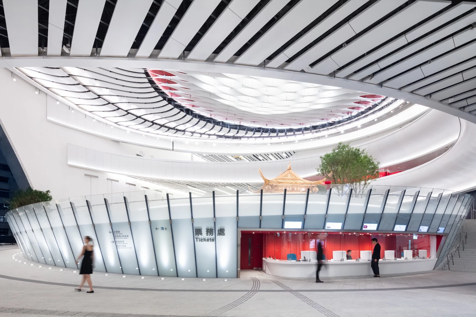 "Qi (meaning flow) is expressed throughout the complex with curvilinear paths and forms and arched entrances designed around a mesmerizing, multi-level circular atrium," says Revery Architecture