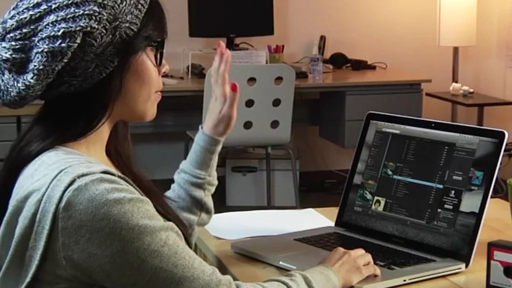 Flutter uses a computer's built-in webcam to allow gesture control in iTunes and Spotify