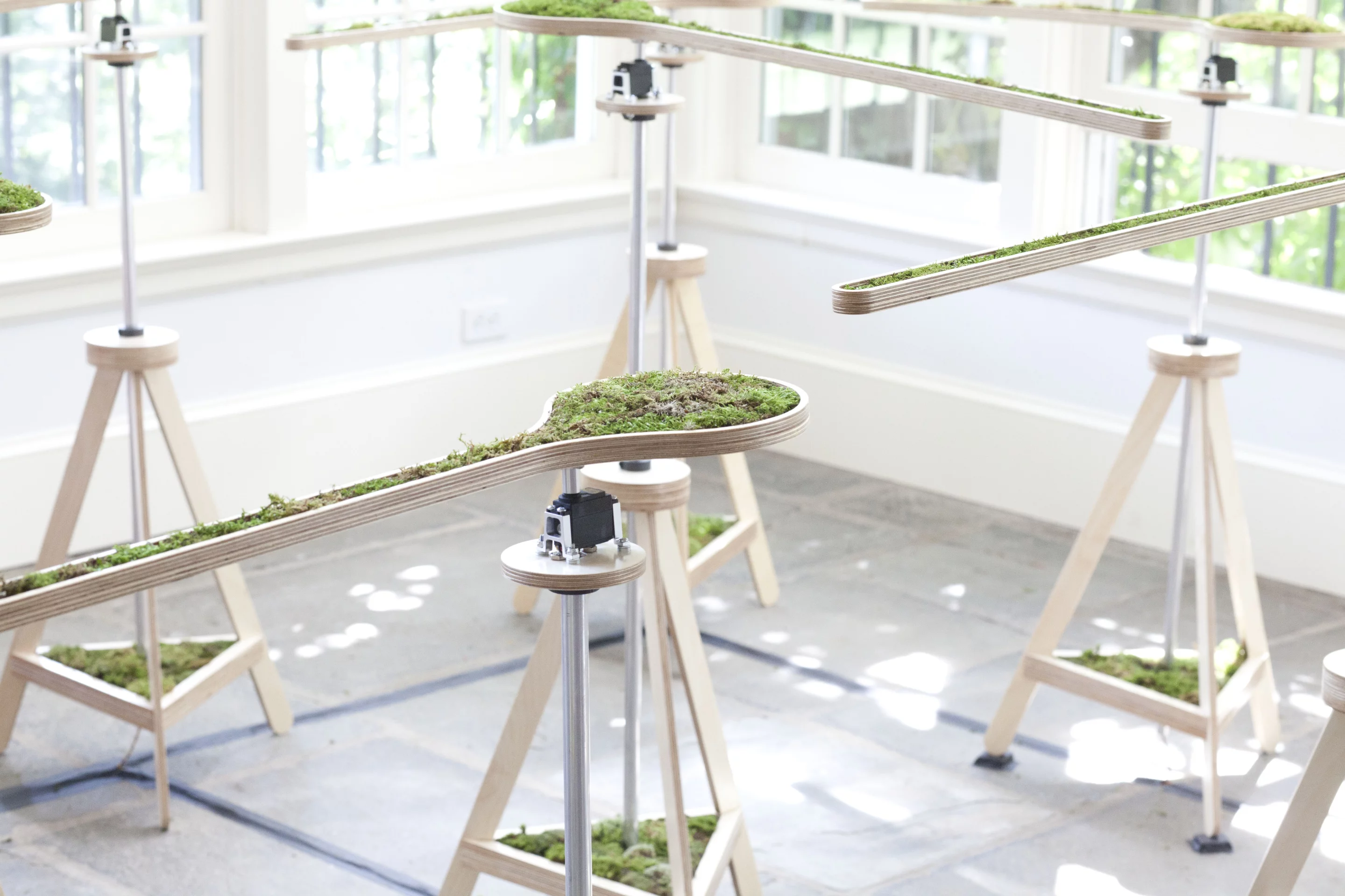 The planters pivot at the circular end, effectively forming rotating gates which open up and shut off parts of the maze