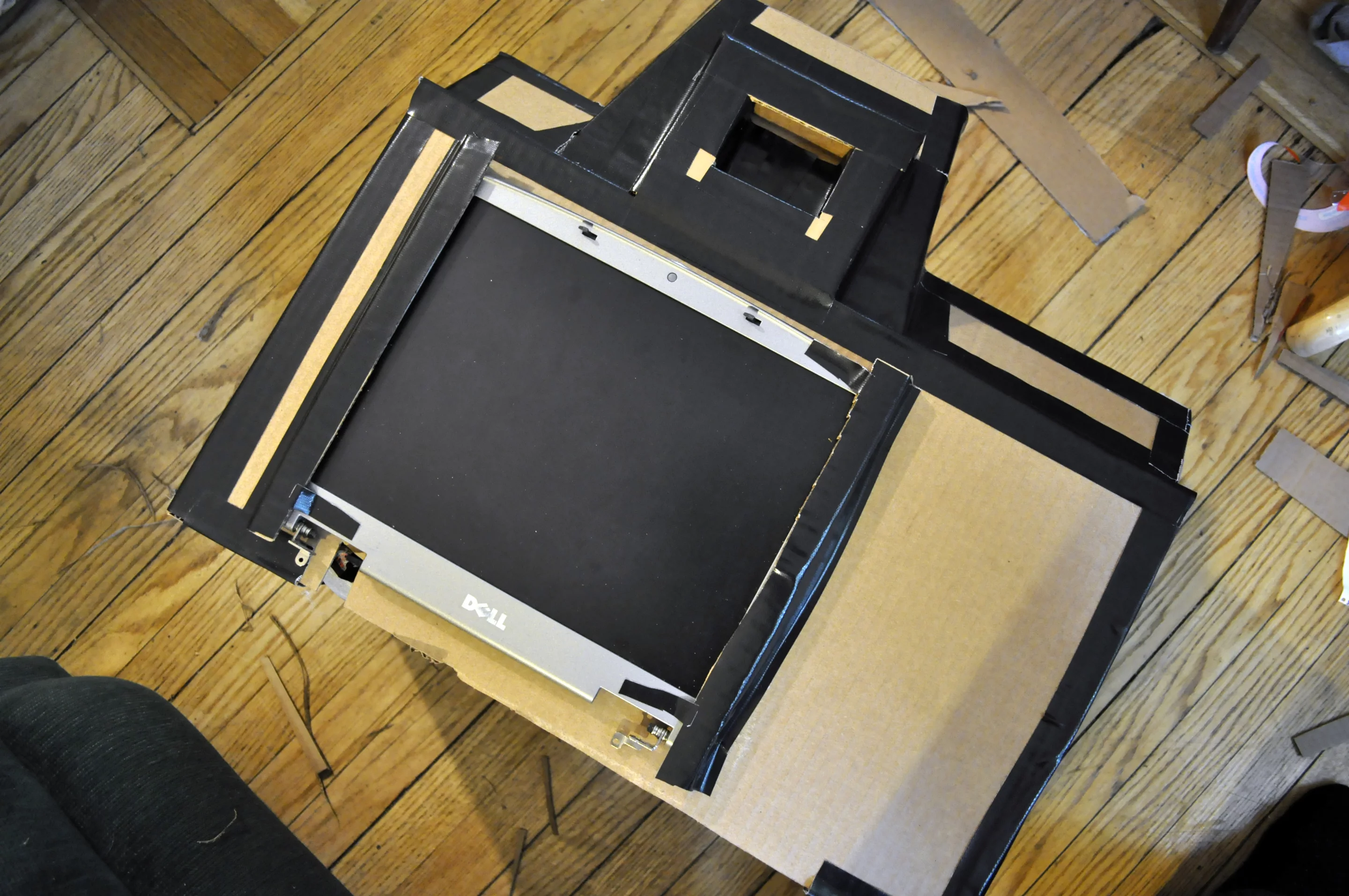 Positioning the LCD screen from an old Dell laptop so that the camera costume can display images of the captured photos (Photo: Tyler Card)