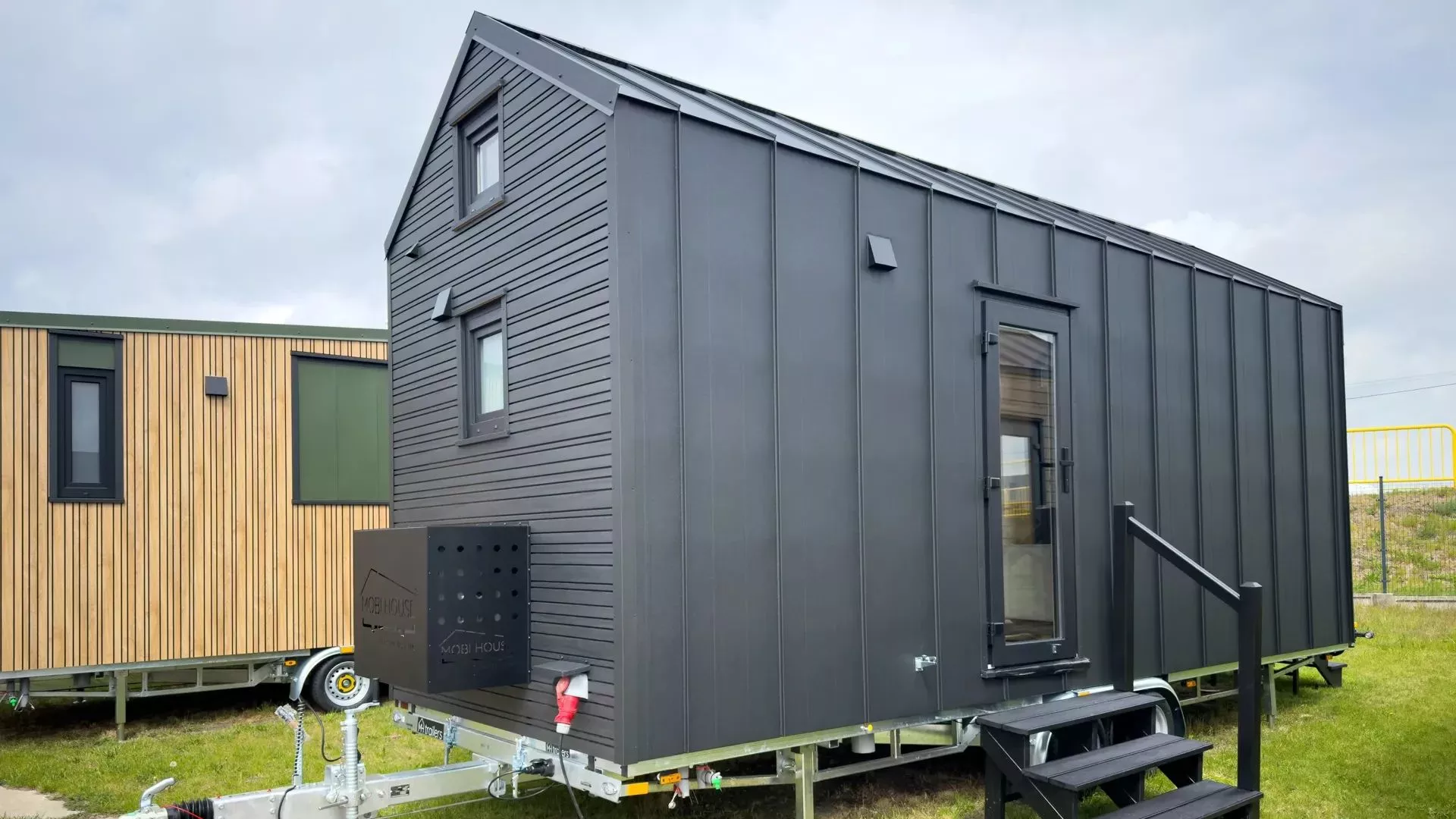 The Chocolate tiny house gets power via a RV-style hookup, and there's a metal storage box mounted to the outside for essentials like propane bottles