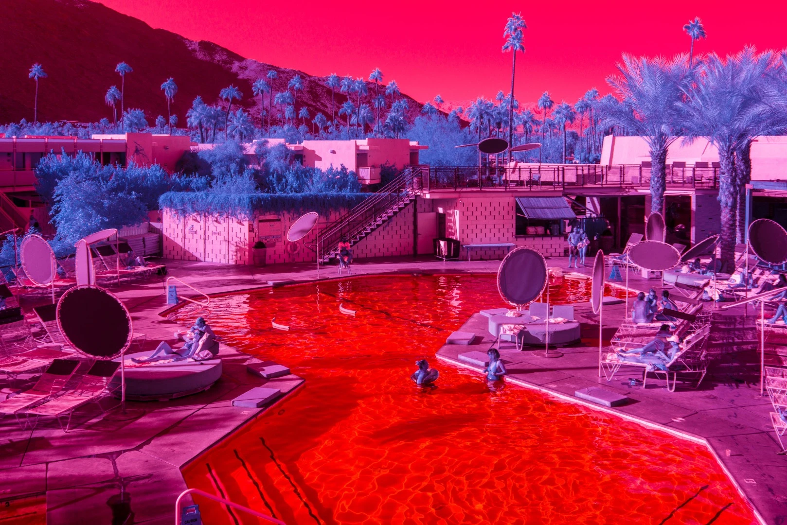 Kate Ballis’ series Infra Realism is an extreme, stylized take on the style contrasting images of classic mid-century Palm Springs architecture with jarringly sharp and disorientating infrared purples and reds