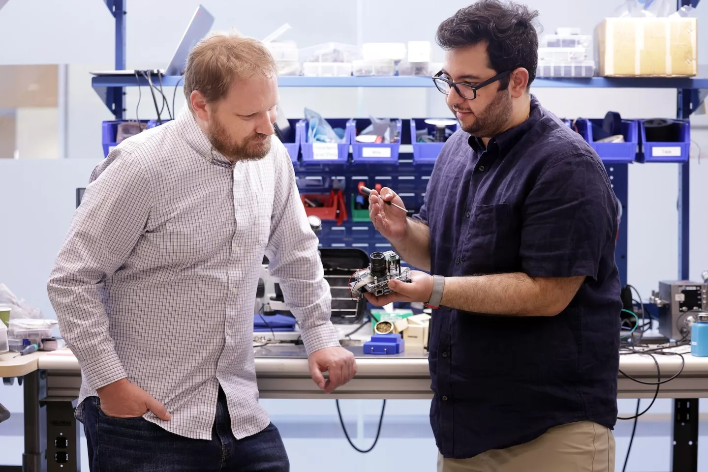 Alanson Sample, an associate professor of computer science and engineering, and Yasha Iravantchi, a doctoral student in computer science and engineering, prepare PrivacyLens for a demonstration
