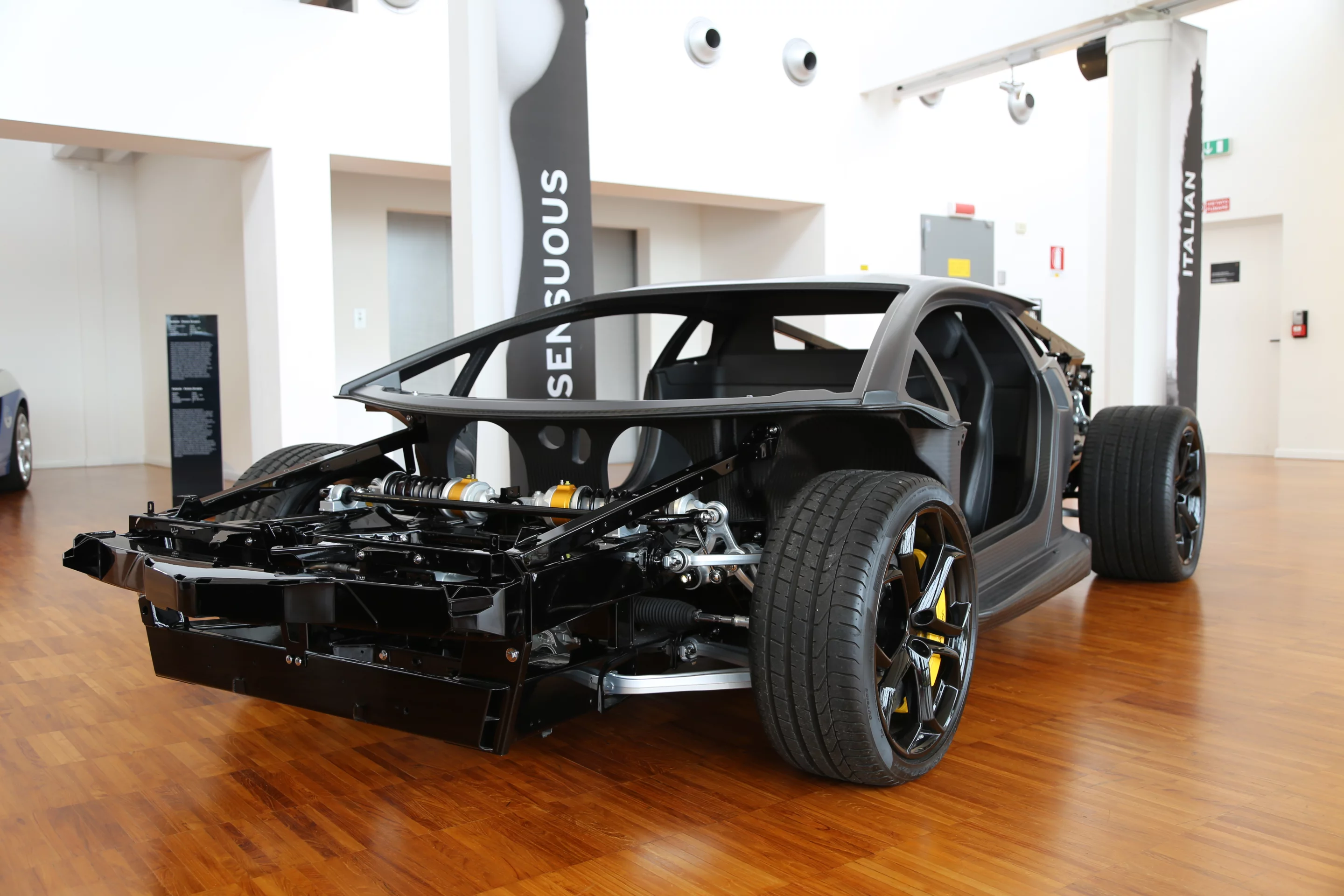 Naked Aventador displays its carbon fiber monocoque and various race inspired suspension bits (Photo: Angus MacKenzie/Gizmag.com)