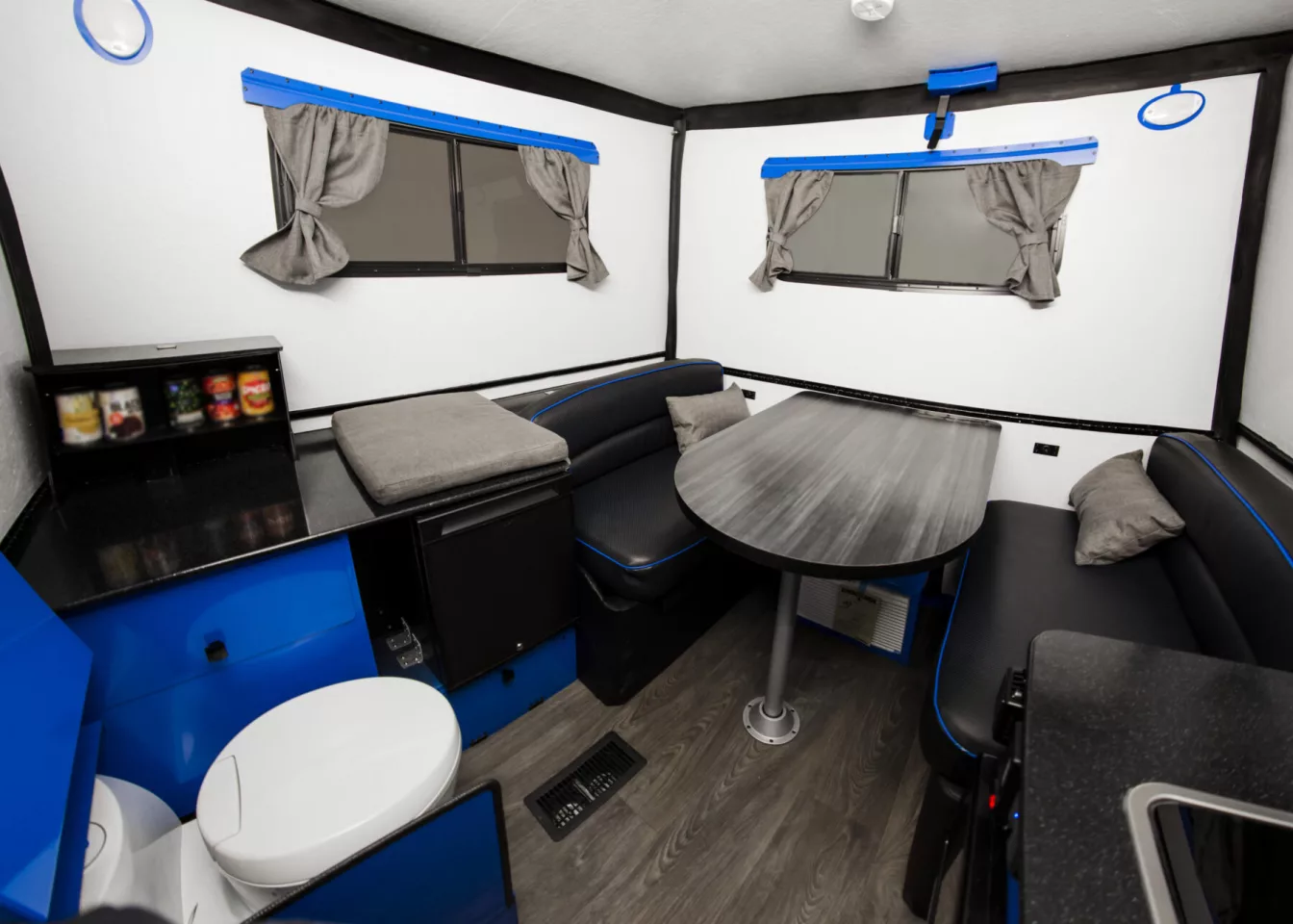 The Cube Series QB's driver side cabinet includes a pop-up pantry and fridge